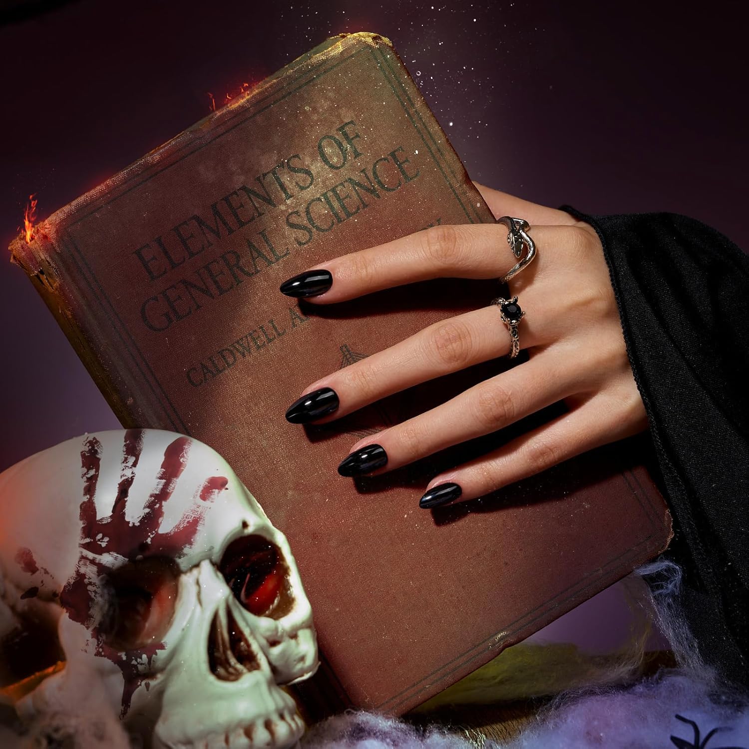 Close-up of Black Velvet almond press-on nails handmade gel polish